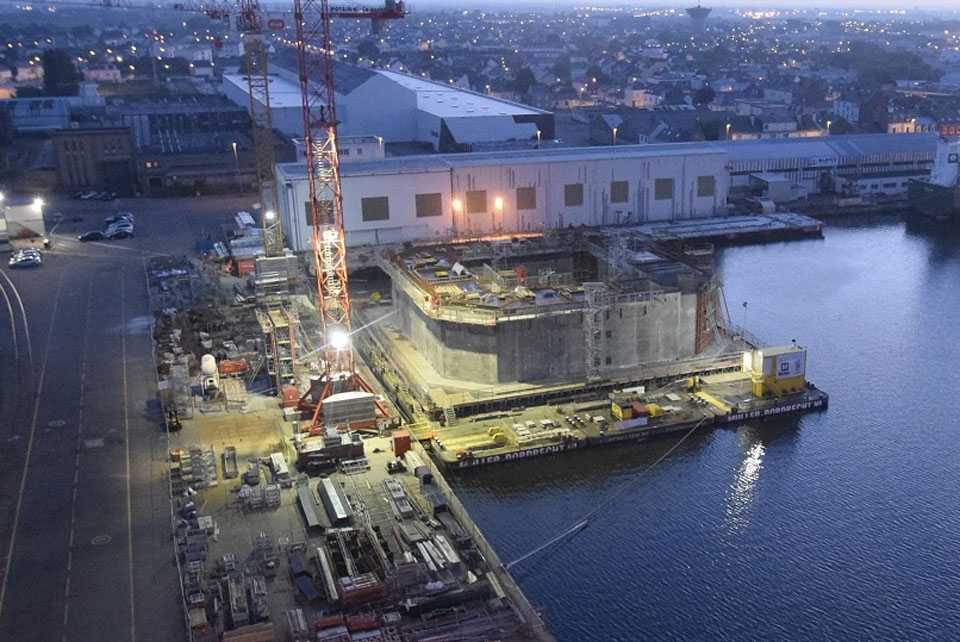 BW Ideol’s Floatgen prototype of 2 MW commissioned in 2016 off the coast of France under construction. The floater was erected with concrete on top of 3 interconnected barges moored at the quayside. Once the construction complete, the floater was released after towing away the barges temporarily and submerging them.